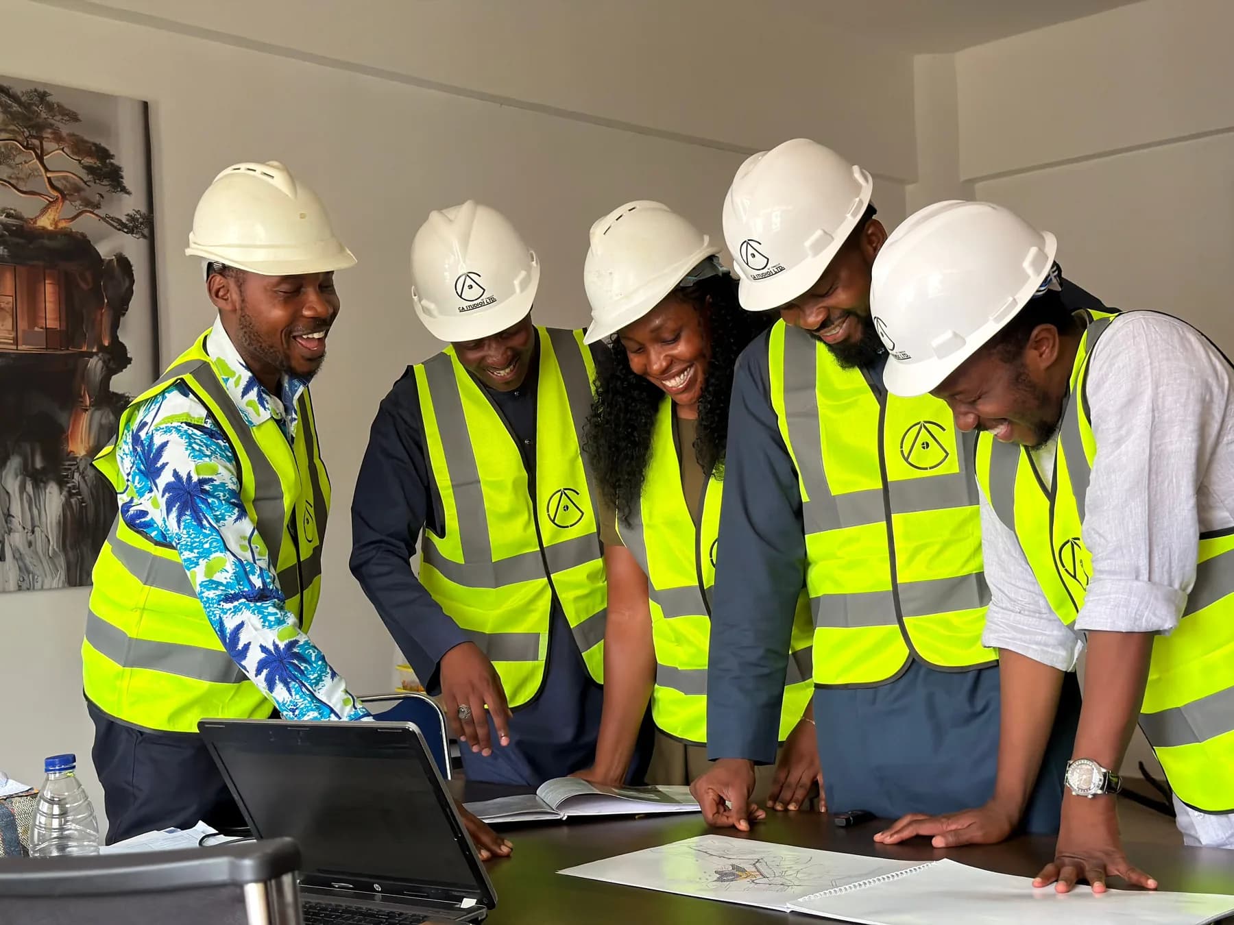 Engineering professionals reviewing plans on site